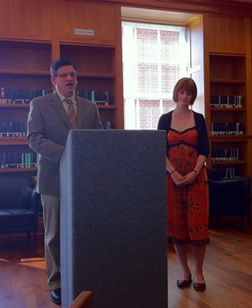 Dr. Adam Goodie speaking with a student next to him