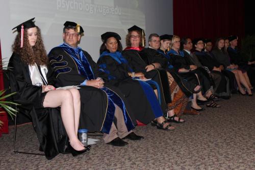 The leaders of the graduation sitting on stage