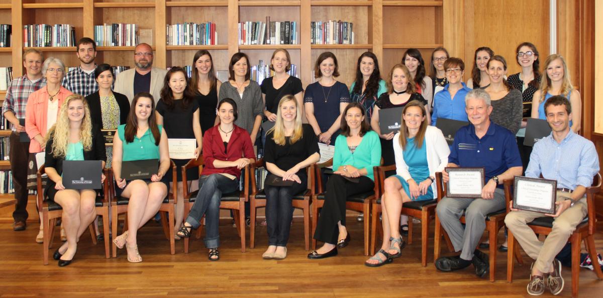 Award winners pose as a group with their awards