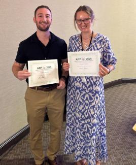 Nate and Leigha pose with certificates
