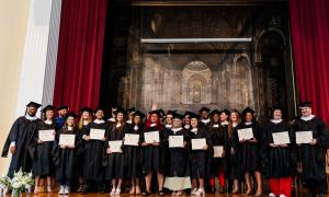 Cohort 9 Group Photo on Stage