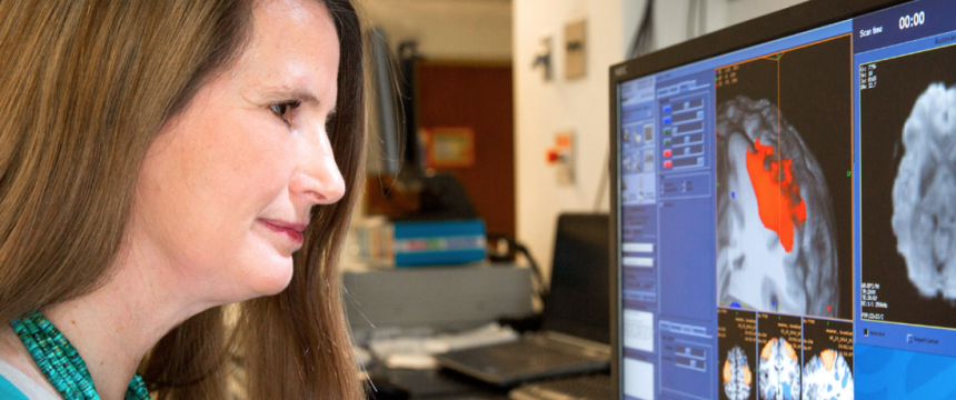 Professor looking at images of the brain 