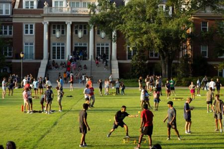 Students playing a group activity in court yard.